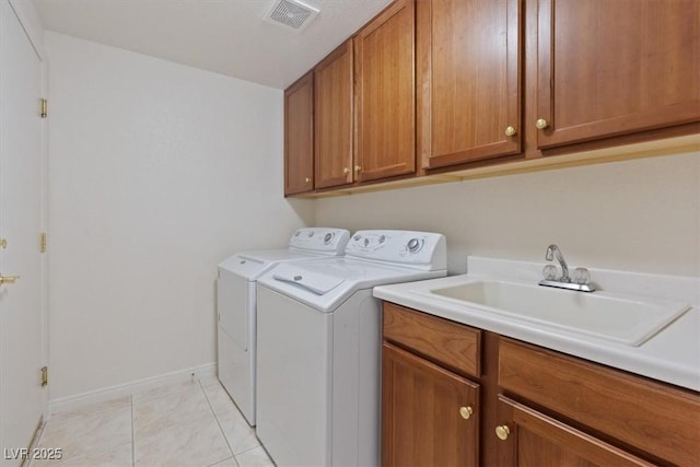 1008 New Creek Ave, Henderson, NV 89015 - laundry room featuring separate washer and dryer, cabinet space, and baseboards