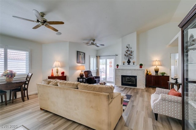 6 Sandwedge Dr, Henderson, NV 89074 - living room with a ceiling fan, plenty of natural light, a tile fireplace, and lofted ceiling
