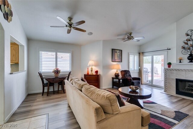 6 Sandwedge Dr, Henderson, NV 89074 - living room with a ceiling fan, healthy amount of natural light, light wood-style flooring, baseboards, and lofted ceiling