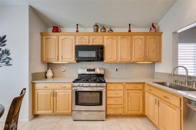 6 Sandwedge Dr, Henderson, NV 89074 - kitchen featuring appliances with stainless steel finishes, a sink, light brown cabinetry, and decorative backsplash