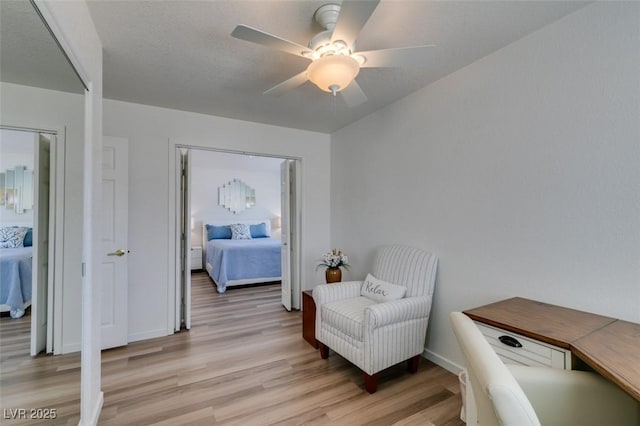 6 Sandwedge Dr, Henderson, NV 89074 - living area with light wood-style floors, a ceiling fan, and baseboards