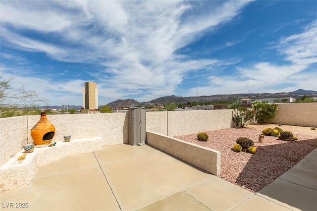 6 Sandwedge Dr, Henderson, NV 89074 - fenced backyard with a patio and a mountain view