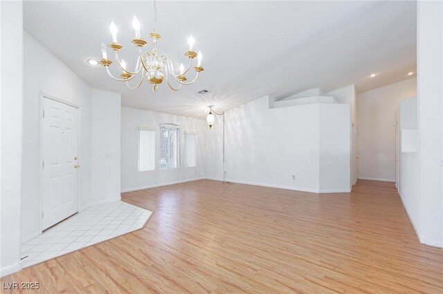9091 W Viking Rd, Las Vegas, NV 89147 - empty room featuring a chandelier, light wood finished floors, baseboards, and recessed lighting
