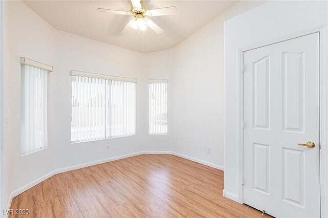 9091 W Viking Rd, Las Vegas, NV 89147 - spare room with light wood-style floors, ceiling fan, and baseboards
