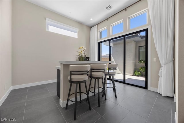 5166 Stone View Dr, Las Vegas, NV 89135 - dining space with dark tile patterned flooring and baseboards