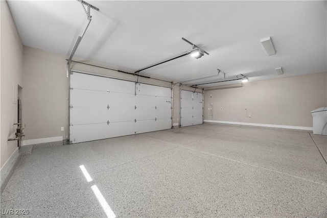 5166 Stone View Dr, Las Vegas, NV 89135 - garage featuring baseboards and a garage door opener