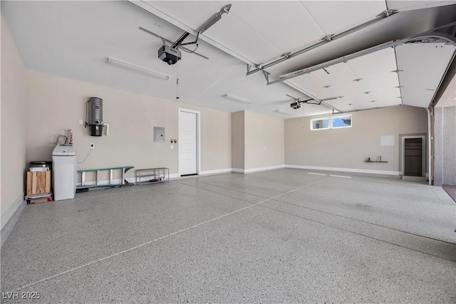 5166 Stone View Dr, Las Vegas, NV 89135 - garage with a garage door opener, baseboards, electric panel, and a central vacuum unit