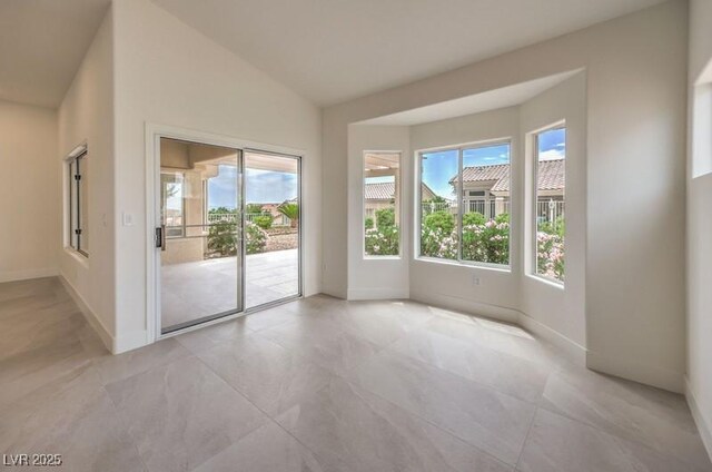 10421 Linfield Pl, Las Vegas, NV 89134 - empty room featuring healthy amount of natural light, baseboards, and light tile patterned flooring