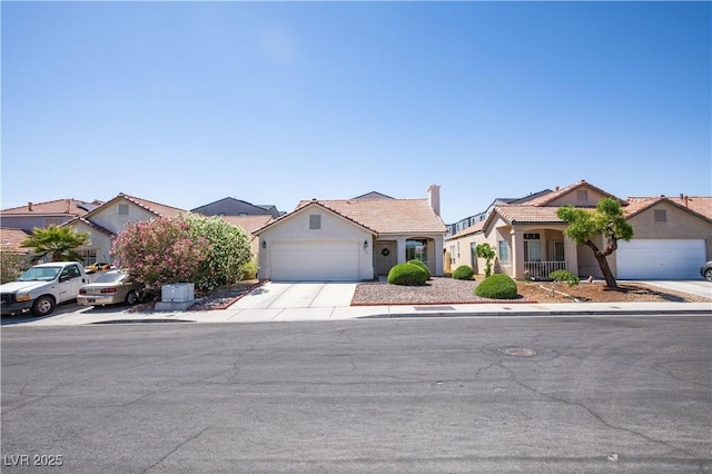8437 Cinnamon Hill Ave, Las Vegas, NV 89129 - view of front facade with concrete driveway, an attached garage, stucco siding, a tile roof, and a residential view