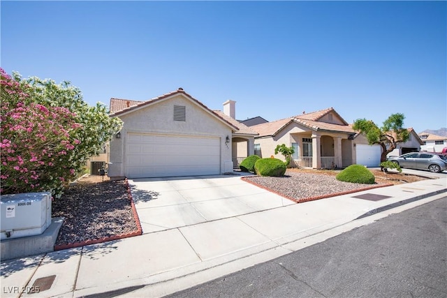 8437 Cinnamon Hill Ave, Las Vegas, NV 89129 - single story home with an attached garage, driveway, stucco siding, a tile roof, and central AC unit
