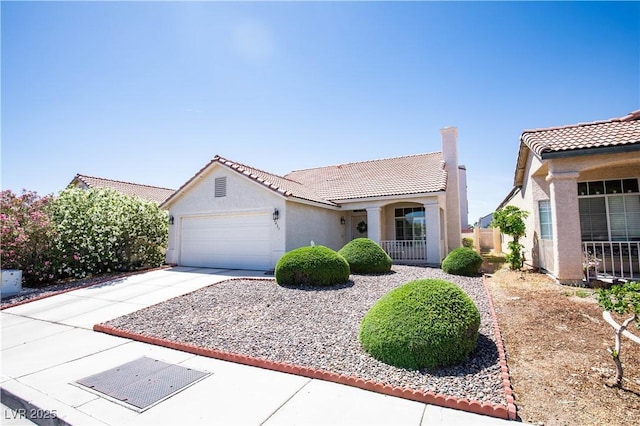 8437 Cinnamon Hill Ave, Las Vegas, NV 89129 - mediterranean / spanish-style home featuring an attached garage, concrete driveway, a tiled roof, and stucco siding