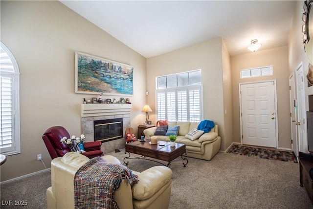 8437 Cinnamon Hill Ave, Las Vegas, NV 89129 - living area with carpet flooring, plenty of natural light, a fireplace, baseboards, and vaulted ceiling