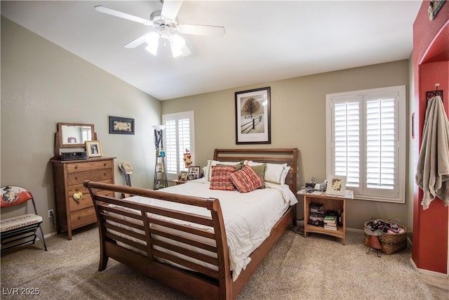8437 Cinnamon Hill Ave, Las Vegas, NV 89129 - bedroom with light colored carpet, lofted ceiling, baseboards, and a ceiling fan