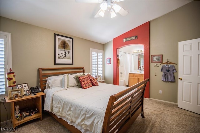8437 Cinnamon Hill Ave, Las Vegas, NV 89129 - bedroom featuring carpet flooring, lofted ceiling, connected bathroom, arched walkways, and ceiling fan