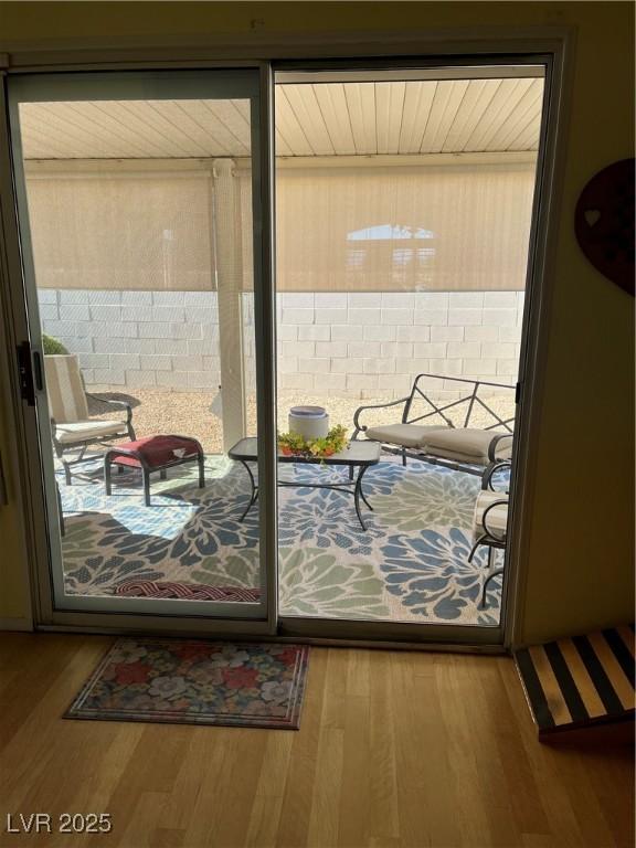 8437 Cinnamon Hill Ave, Las Vegas, NV 89129 - doorway to outside with wood finished floors