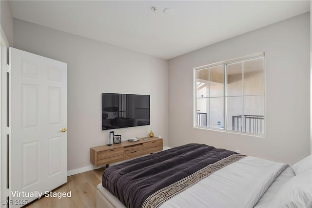 7155 S Durango Dr Unit 309, Las Vegas, NV 89113 - bedroom featuring wood finished floors and baseboards