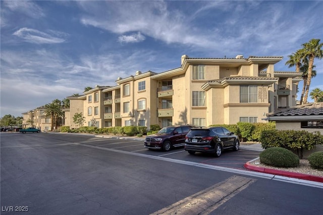 7155 S Durango Dr Unit 309, Las Vegas, NV 89113 - view of building exterior featuring uncovered parking