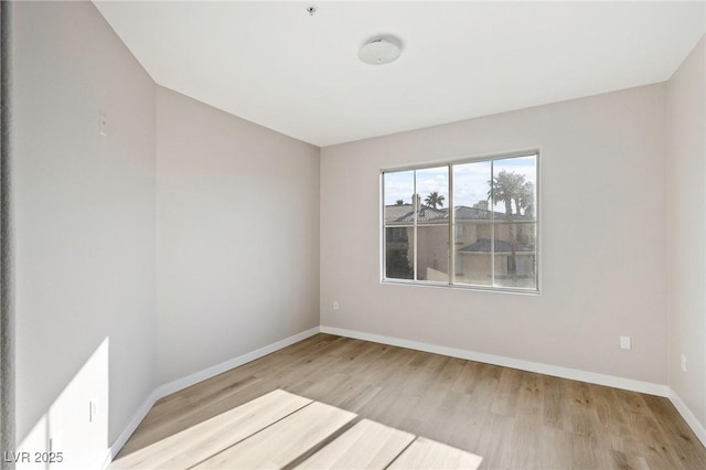 7155 S Durango Dr Unit 309, Las Vegas, NV 89113 - spare room with wood finished floors and baseboards