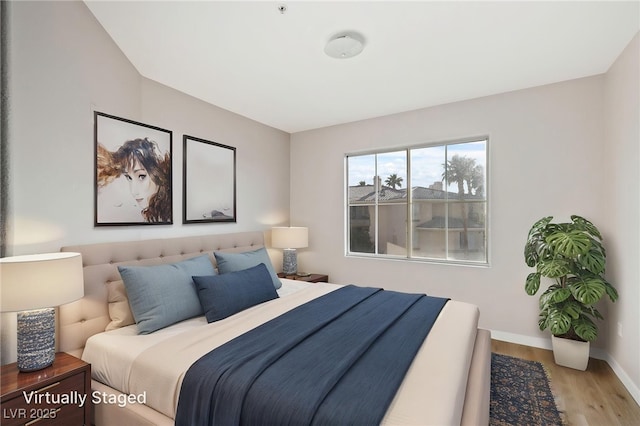 7155 S Durango Dr Unit 309, Las Vegas, NV 89113 - bedroom featuring wood finished floors and baseboards