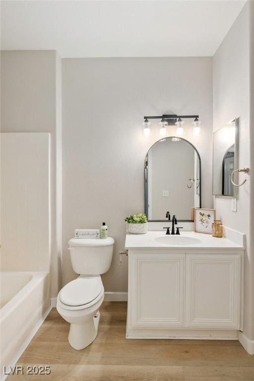 7155 S Durango Dr Unit 309, Las Vegas, NV 89113 - full bath with toilet, wood finished floors, vanity, and baseboards