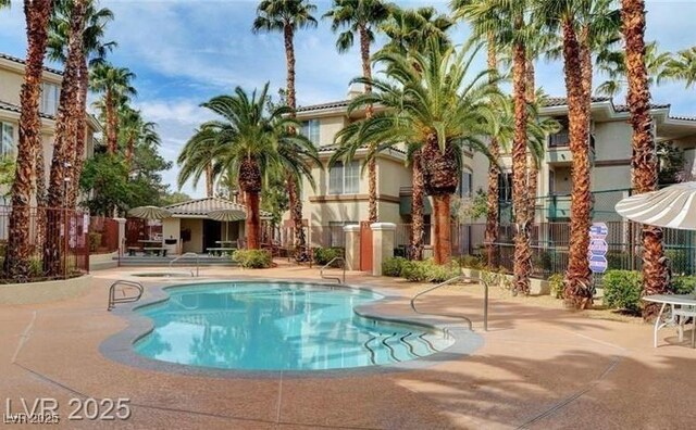 7155 S Durango Dr Unit 309, Las Vegas, NV 89113 - community pool featuring a patio