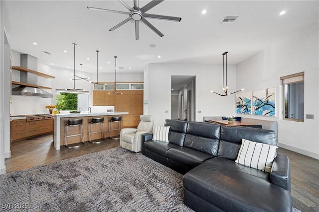 4050 N Tomsik St, Las Vegas, NV 89129 - living room featuring wood finished floors, ceiling fan, a chandelier, recessed lighting, and baseboards