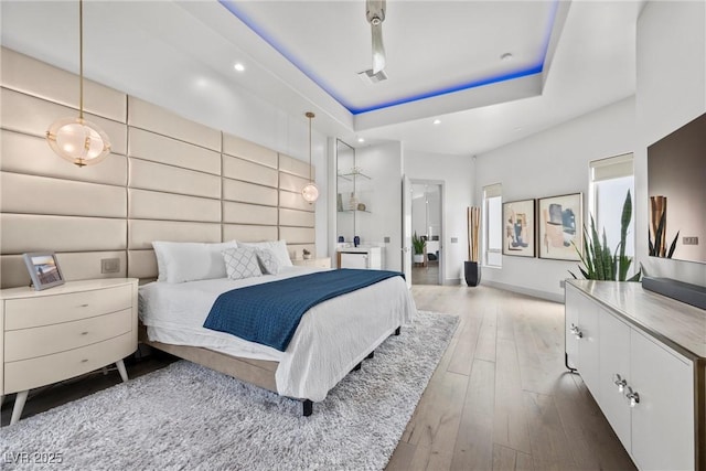 4050 N Tomsik St, Las Vegas, NV 89129 - bedroom with a tray ceiling, hardwood / wood-style floors, and recessed lighting
