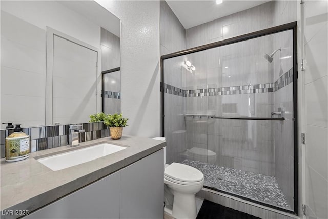 4050 N Tomsik St, Las Vegas, NV 89129 - full bath featuring toilet, a shower stall, vanity, and tasteful backsplash