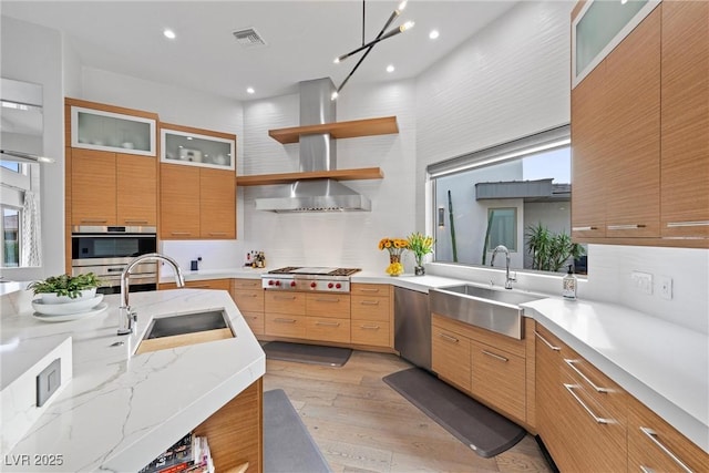 4050 N Tomsik St, Las Vegas, NV 89129 - kitchen featuring a sink, stainless steel appliances, light wood-type flooring, modern cabinets, and recessed lighting