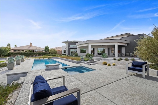 4050 N Tomsik St, Las Vegas, NV 89129 - outdoor pool with a patio and an in-ground hot tub