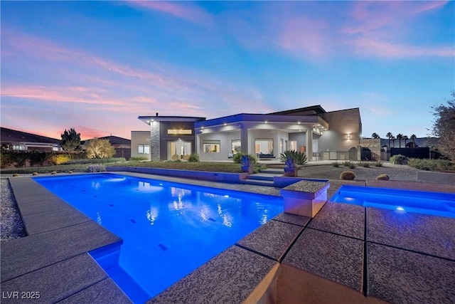 4050 N Tomsik St, Las Vegas, NV 89129 - pool at dusk with an outdoor pool and a patio area