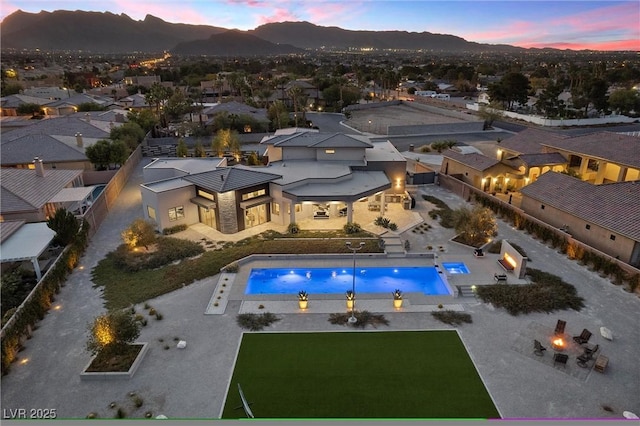 4050 N Tomsik St, Las Vegas, NV 89129 - aerial perspective of suburban area with a pool and a mountain backdrop