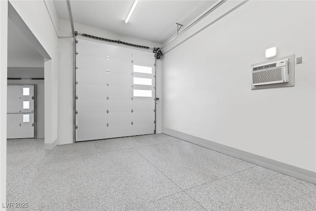 4050 N Tomsik St, Las Vegas, NV 89129 - garage featuring a wall mounted air conditioner and baseboards