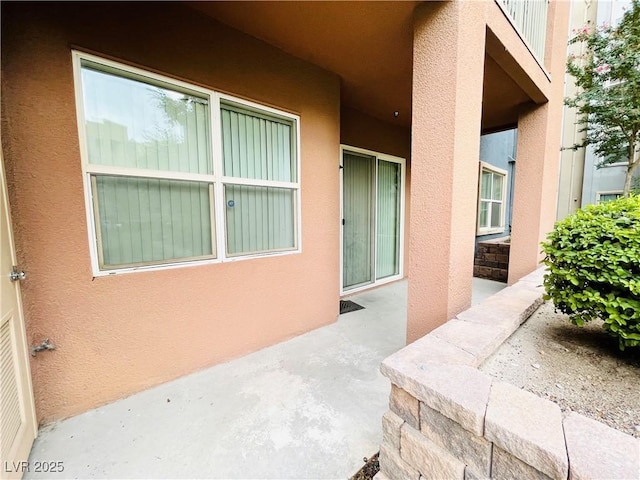 62 E Serene Ave Unit 115, Las Vegas, NV 89123 - entrance to property with stucco siding and a patio