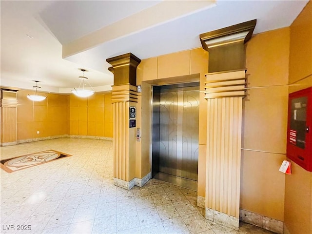 62 E Serene Ave Unit 115, Las Vegas, NV 89123 - corridor with elevator, ornate columns, and light floors