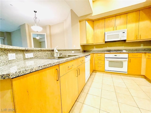 62 E Serene Ave Unit 115, Las Vegas, NV 89123 - kitchen featuring white appliances, a sink, light tile patterned flooring, light stone countertops, and a peninsula