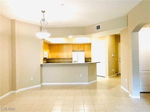 62 E Serene Ave Unit 115, Las Vegas, NV 89123 - kitchen with white appliances, arched walkways, a peninsula, light tile patterned floors, and pendant lighting