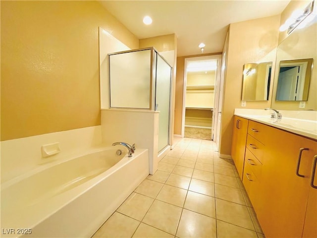 62 E Serene Ave Unit 115, Las Vegas, NV 89123 - bathroom featuring a shower stall, vanity, a bath, tile patterned floors, and recessed lighting