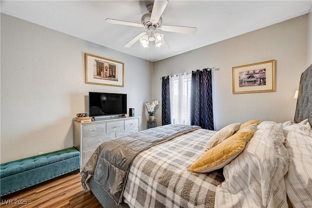 5751 E Hacienda Ave Unit 154, Las Vegas, NV 89122 - bedroom featuring wood finished floors and a ceiling fan