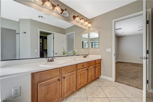 7637 Good Fortune Ct, Las Vegas, NV 89139 - bathroom featuring double vanity, tile patterned floors, and baseboards