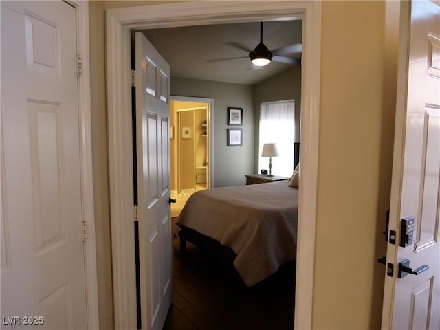 9705 Templemore Ave Unit 102, Las Vegas, NV 89129 - bedroom featuring ensuite bath, dark wood-style floors, a ceiling fan, and vaulted ceiling