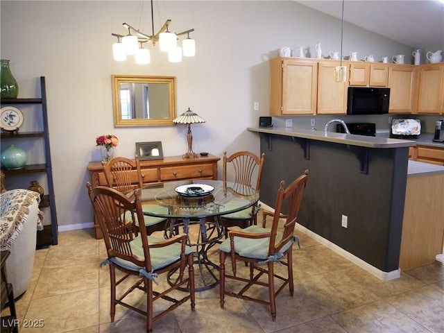 9705 Templemore Ave Unit 102, Las Vegas, NV 89129 - dining room featuring lofted ceiling, a chandelier, baseboards, and light tile patterned floors