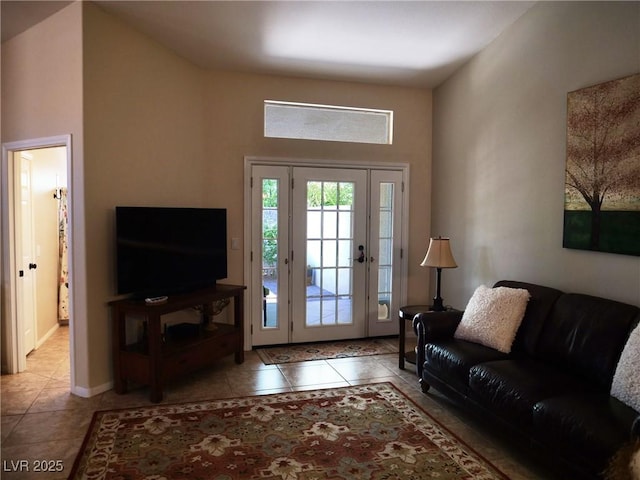 9705 Templemore Ave Unit 102, Las Vegas, NV 89129 - tiled living room featuring a towering ceiling and baseboards