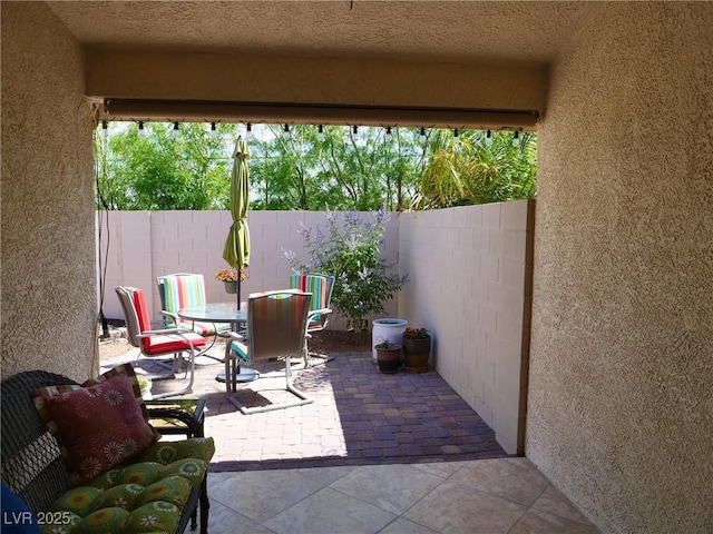 9705 Templemore Ave Unit 102, Las Vegas, NV 89129 - view of patio / terrace with outdoor dining area