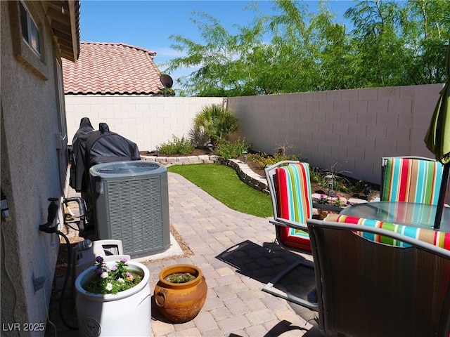 9705 Templemore Ave Unit 102, Las Vegas, NV 89129 - fenced backyard with central AC unit and a patio area