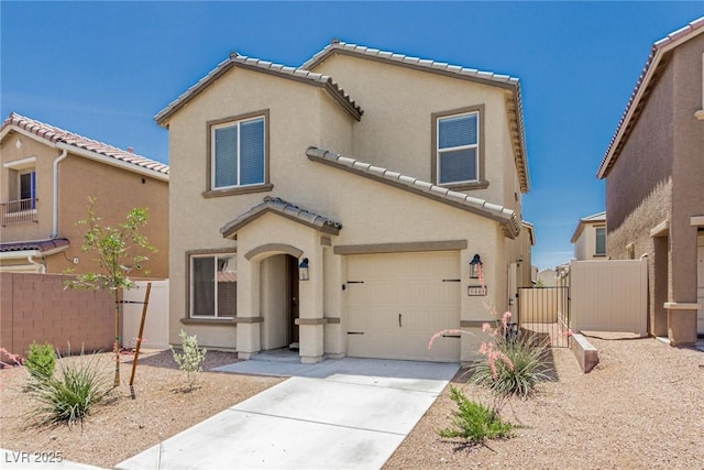 6443 Burlap Ct, Las Vegas, NV 89122 - view of front of home featuring stucco siding, a tile roof, a garage, driveway, and a gate