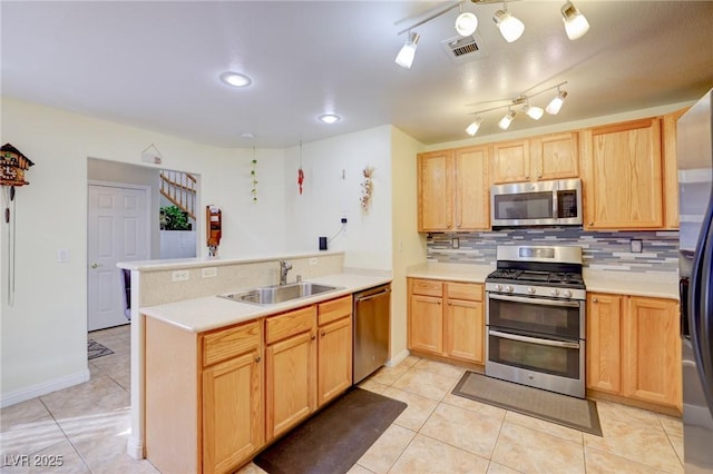 602 Painted Cloud Pl, Las Vegas, NV 89144 - kitchen featuring stainless steel appliances, a sink, a peninsula, and light brown cabinets