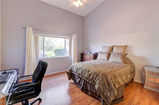 602 Painted Cloud Pl, Las Vegas, NV 89144 - bedroom featuring wood finished floors, baseboards, a desk, and high vaulted ceiling