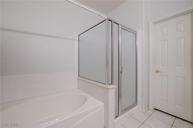 602 Painted Cloud Pl, Las Vegas, NV 89144 - bathroom with a stall shower, a garden tub, and tile patterned floors