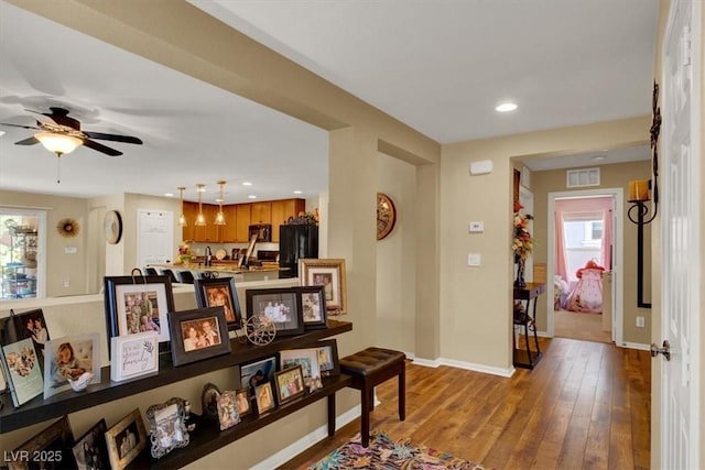 759 Star Apple Ln, Las Vegas, NV 89178 - corridor with plenty of natural light, baseboards, hardwood / wood-style flooring, recessed lighting, and a sink